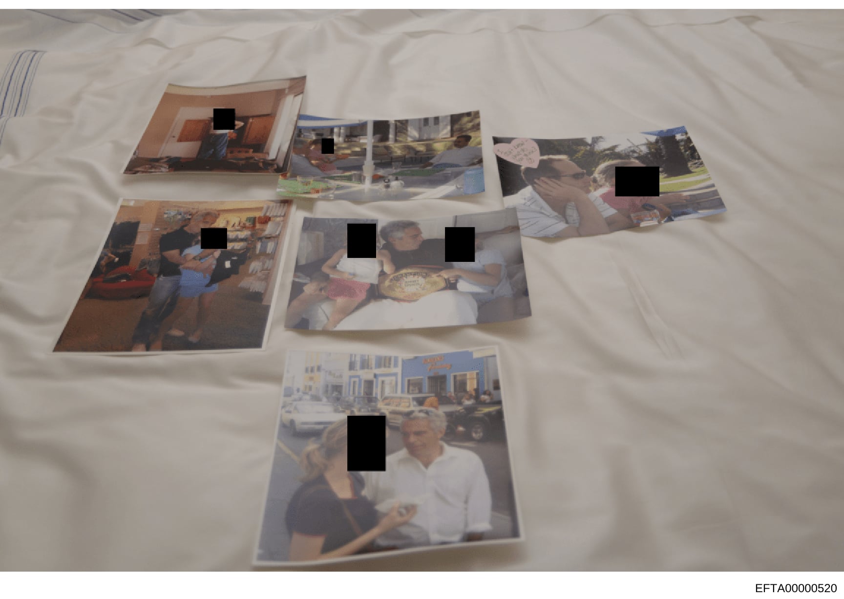 This evidence photograph shows a collection of approximately 7-8 printed photographs arranged on a white surface, documenting what appears to be personal social occasions and residential settings. Multiple faces in the photographs have been redacted 