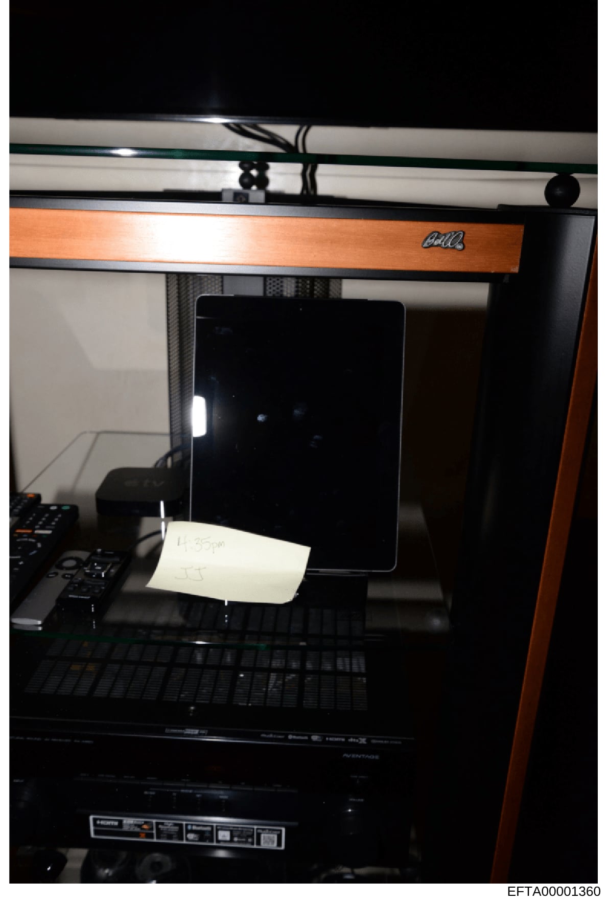 This is a photograph of a 3D printer (appears to be a MakerBot or similar consumer-grade model) with an orange/wooden trim. The image shows the interior of the printer with a black screen/display panel and a white note or paper placed inside the prin