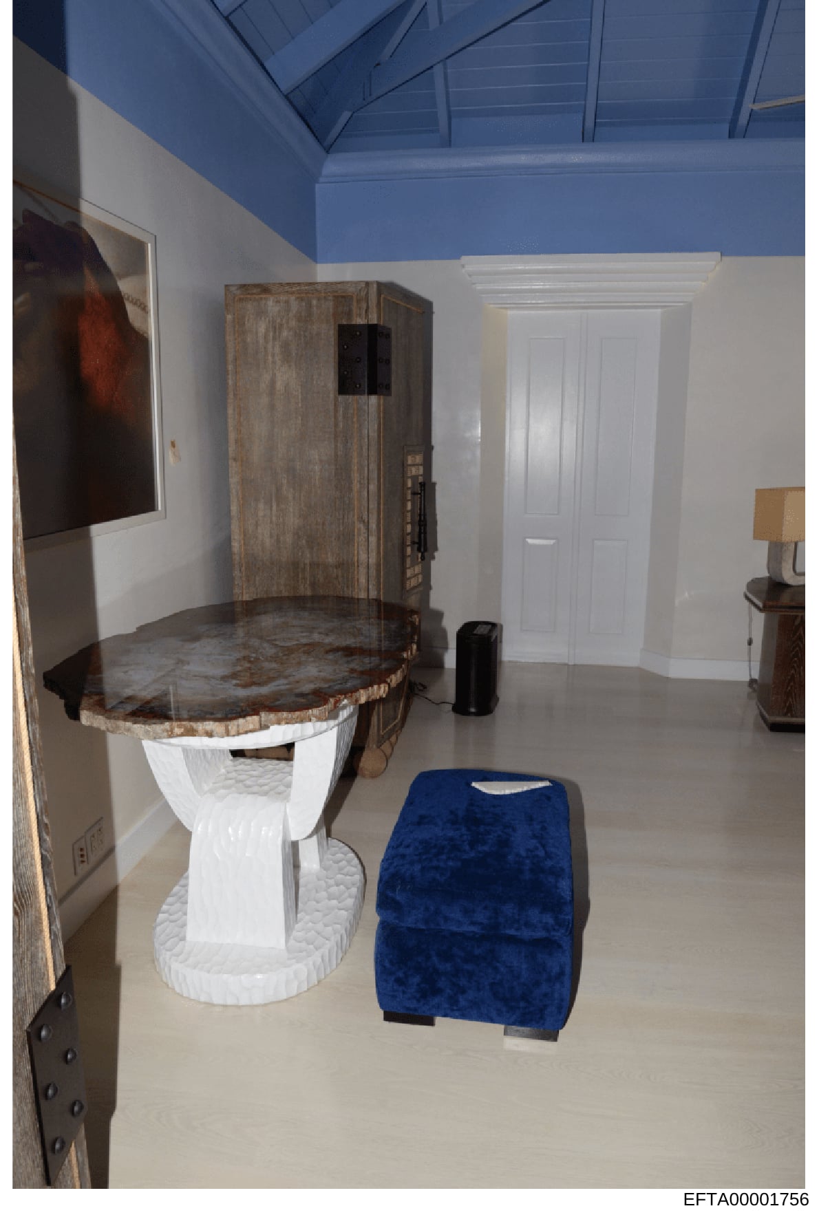 This is an evidence photograph showing the interior of a bathroom or property room, featuring an ornate toilet with a decorative wooden seat and trunk-like upper structure, white porcelain base, and artistic furnishings. The room has a distinctive tw