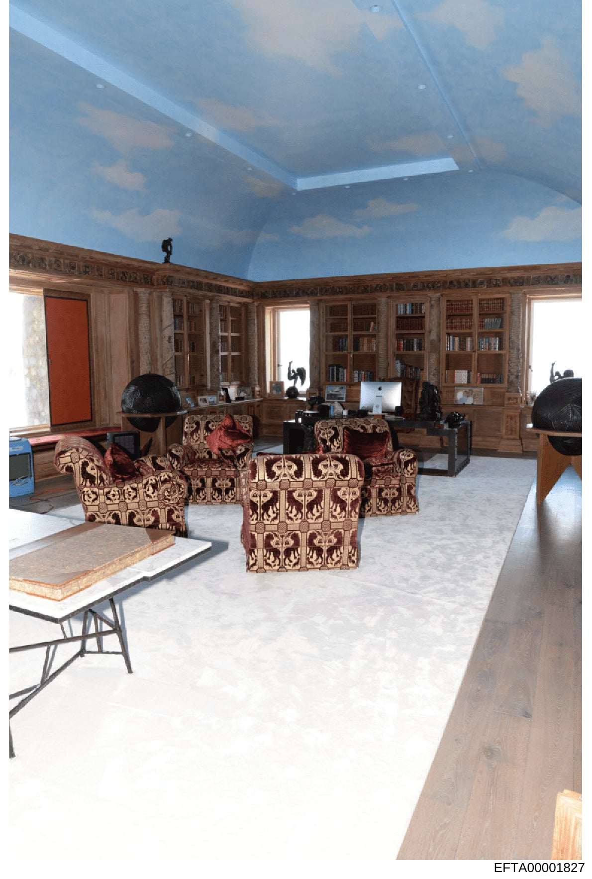 This is an evidence photograph of an upscale interior room featuring extensive built-in wooden cabinetry, bookshelves, ornate furniture, and modern office equipment. The space appears to be part of a high-end residential or office property, documenti