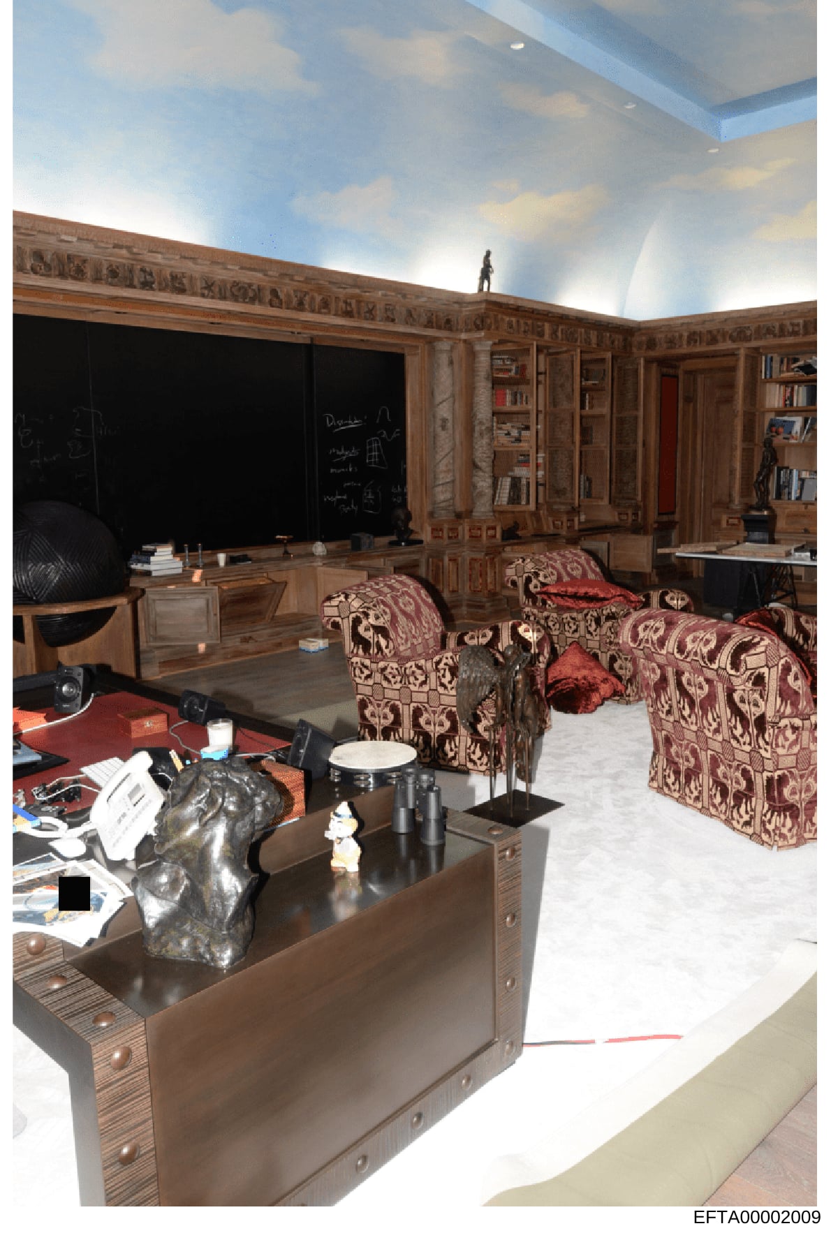 This photograph documents an upscale residential interior featuring a sophisticated office and library area with custom wood paneling, built-in cabinetry, decorative furnishings, and artwork. The image appears to be from a property inspection or evid