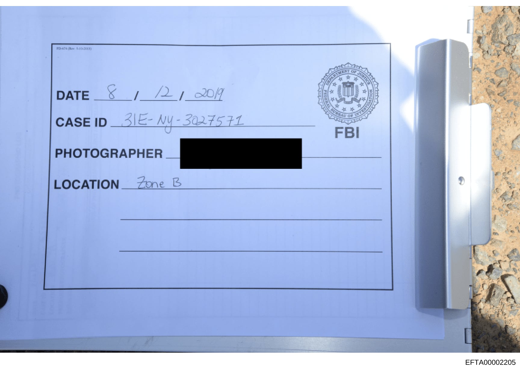 This is an FBI evidence documentation label used to catalog a photograph taken during the investigation. Dated August 12, 2019, it shows the case ID 3IE-NY-302757I and indicates the photograph was taken in 'Zone B' of a location under investigation. 
