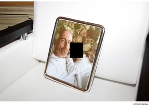 This is an evidence photograph showing a framed portrait of a middle-aged man in a white shirt, displayed on a nightstand in what appears to be a bedroom. The photo was taken during a search or inspection of a residence, likely as part of the investi