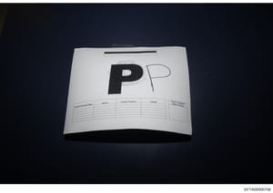 This is a photograph of an evidence envelope or bag used in law enforcement to store and track physical evidence. The envelope displays a large 'PP' marking and includes a pre-printed form with fields for recording search personnel name, agency, cont