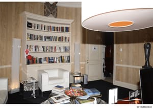 This is a photograph of an interior room featuring a large built-in bookshelf with extensive book collection, modern furnishings including a white armchair, and contemporary design elements. The room appears to be part of a residential property and m