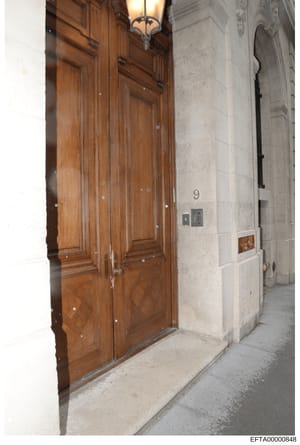 This is a photograph of the exterior entrance to a building located at 9 East 71st Street in New York City, showing a wooden double door entrance marked with the number 9. The image appears to be part of the investigative documentation of properties 