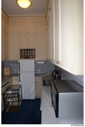 This is a photograph of a kitchen interior showing appliances, cabinetry, and finishes. The image appears to be documentation of a residential property, likely taken as part of the investigation's evidence collection regarding Epstein's properties an