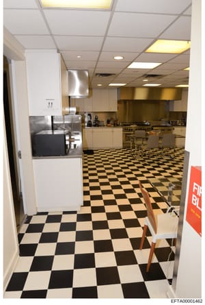 This photograph shows a large commercial kitchen space, likely from an Epstein property, featuring professional-grade cooking equipment, stainless steel appliances, and institutional catering setup. The image documents the scale and quality of food p
