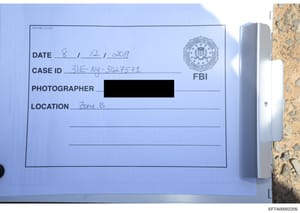 This is an FBI evidence documentation label used to catalog a photograph taken during the investigation. Dated August 12, 2019, it shows the case ID 3IE-NY-302757I and indicates the photograph was taken in 'Zone B' of a location under investigation. 