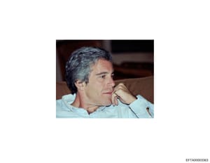 This is a color photograph showing a middle-aged man in profile, seated indoors against a brown upholstered background. The image appears to be a documentary or investigative photograph included in the Epstein case files. The subject is wearing a lig