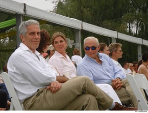 This photograph shows a group of people seated at an outdoor event under a covered pavilion structure. The image captures multiple attendees in casual-formal attire, with trees visible in the background. The photo is dated and catalogued as evidence 