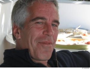This is a photograph of a middle-aged male subject taken outdoors on what appears to be a boat or marine vessel. The image shows the subject in close-up, with water and another vessel visible in the background. The photo is catalogued as evidence in 