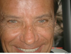 This is a close-up photograph of a male subject's face, taken indoors. The image shows facial features in detail and includes a timestamp reading '25 5:56PM' in the lower right corner. The photograph's purpose within the investigation context is uncl