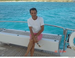 A casual personal photograph showing a middle-aged man on the deck of a yacht in clear tropical waters. The image appears to be from July 2012 based on the timestamp visible in the photo. The photo was recovered as part of the Epstein investigation f