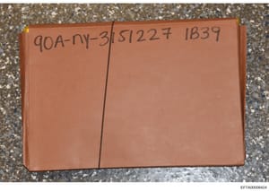 This is a photograph of a sealed orange/terracotta colored folder or envelope bearing handwritten case reference numbers (90A-NY-3, 51227, IB39). The folder appears to be physical evidence documentation or storage from the investigation. The sealed c