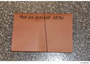 This is a photograph of a terracotta/orange-colored evidence envelope or storage container with a handwritten case reference number. The marking '90A-NY-315/227 1830' indicates this is part of the Jeffrey Epstein investigation files (90A series), spe