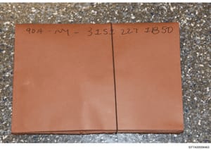 This is a photograph of a sealed tan/brown envelope or file folder bearing handwritten reference numbers and case identifiers. The markings '904-NY-315‡227 IBSD' suggest this is an evidence container or sealed file related to the FBI investigation, p